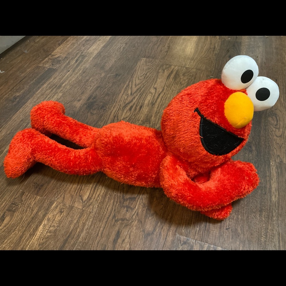 Elmo laying down